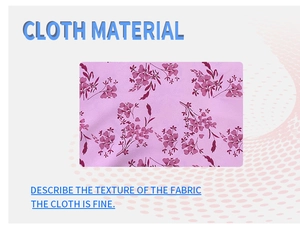 Detailed close-up of pink floral fabric material with fine purple flower patterns
