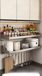 Detailed view of gunmetal kitchen rack with hooks and cutting board holder