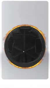 Detailed macro view of the thick fleece lining and cross-stitching in a black winter beanie