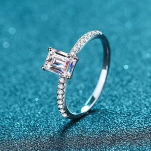 Luxurious S925 sterling silver ring featuring an emerald cut moissanite and pavé accents