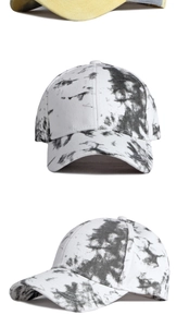 Macro detail of cotton tie-dye baseball cap showing fabric texture and crown stitching