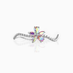 Detail of flower ring with silver wavy beaded band and iridescent colorful crystals