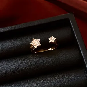 18k gold plated adjustable star ring set with white cubic zirconia in a jewelry box