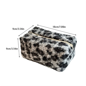 Detailed view of leopard plush makeup bag with 18x9x9cm dimensions on white background
