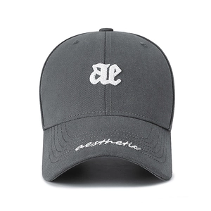 Dark gray cotton baseball cap with white ae embroidery and aesthetic text on the brim