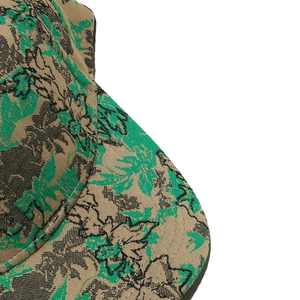 Macro shot of baseball cap fabric with vintage floral jacquard pattern and premium stitching
