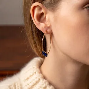 Elegant 24k gold-plated hoop earrings featuring a navy blue square-cut gemstone drop