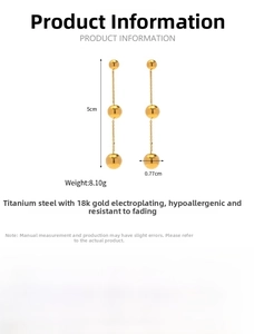 Detail view of 18K gold plated ball earrings showing 5cm length and 0.77cm diameter measurements
