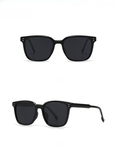 Front and side view of classic black polarized round frame sunglasses with rivet details