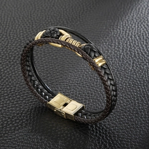 Macro shot of stainless steel buckle on multilayer braided leather bracelet for men