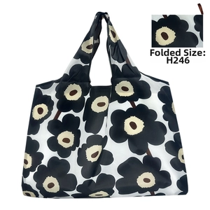 Detail of a foldable Oxford cloth tote bag with black and white floral print in style H246