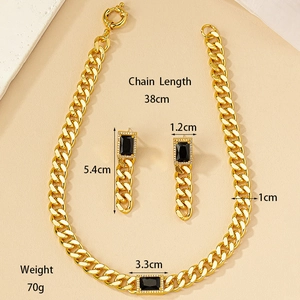 Detail showing dimensions of gold Cuban chain set with black stones and rhinestones