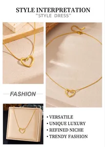 Detailed view of a golden hollow heart pendant necklace with a fine snake chain finish