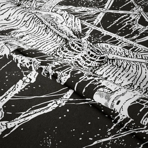 Macro shot of skull and tree branch patterns on gothic style tapestry fabric