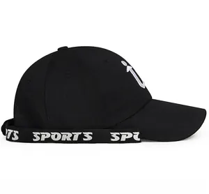 Detail view of black cotton baseball cap with white embroidery and sports ribbon trim