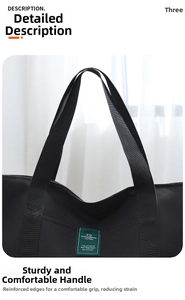 Detail showing reinforced comfortable handles on large capacity black travel duffel bag