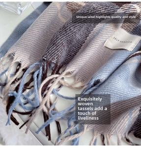 Detailed close-up of checkered scarf showing knit texture, soft fringe, and woven label