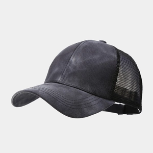 Detail of distressed dark grey trucker hat showing breathable black mesh and stitch detail