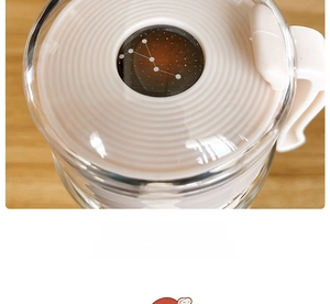 Close-up of the Cancer constellation dome ornament on a minimalist white glass lid