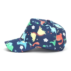 Detailed view of kids navy blue baseball cap featuring colorful cartoon dinosaur prints
