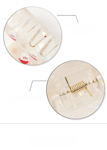 Detail of Christmas hair claw featuring a strong golden spring and smooth finish