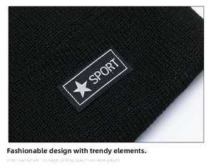 Close-up of black knitted beanie featuring sport label with fine texture and stitching