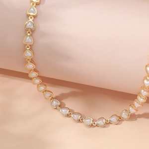 French vintage gold heart chain necklace with cream inlay and textured metal edges