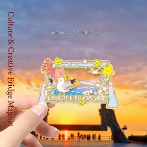 Handheld Weihai souvenir fridge magnet with colorful ocean elements at sunset beach