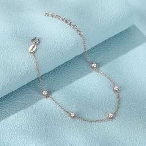 Close-up of S925 sterling silver chain bracelet with round zircon accents and spring clasp