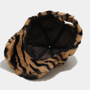 Plush faux fur baseball cap with tiger stripe pattern and breathable black mesh lining