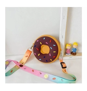 Detail of donut silicone crossbody bag with colorful sprinkles and wide gradient strap