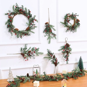 European faux Christmas wreath and garland set with pine cones for festive wall decor