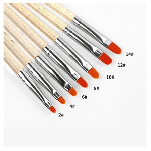 Detail of 7 professional UV gel nail brushes with glitter handles and round tips