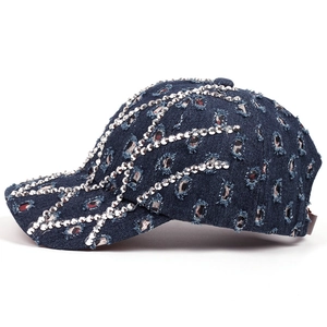 Distressed dark blue denim baseball cap with silver rhinestone wave pattern and side view