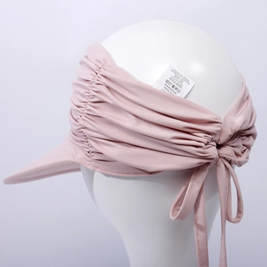 Detail der rosa Sonnenblende mit Schleife, aus 82 % Nylon und 18 % Elasthan-Mischgewebe