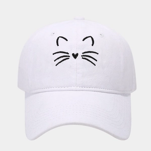 Detailed close-up of white cotton baseball cap with cute black cat whiskers embroidery