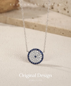 Detail shot of a S925 silver necklace featuring a blue evil eye pendant with crystal pavé