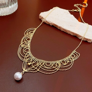 Detail view of French lace woven pearl necklace on elegant stone and leather background