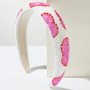 Detail of handmade white and red beaded wide headband with velvet inner lining