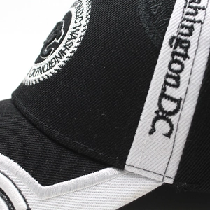 Macro detail of Washington D.C. embroidery on a cotton twill baseball cap side