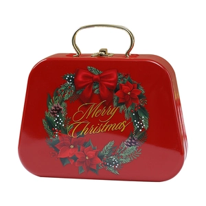 Christmas themed red metal gift box with golden handle and Merry Christmas wreath print