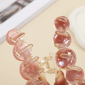 Pink transparent round bead hair claw clip with a matte finish for elegant hair styling