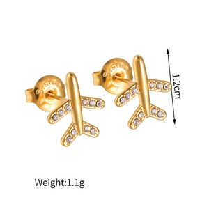 Detailed view of gold airplane stud earrings with S. steel mark and crystal stones