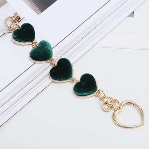 Detail of dark green velvet heart pendant chain with gold metal frame for phone cases