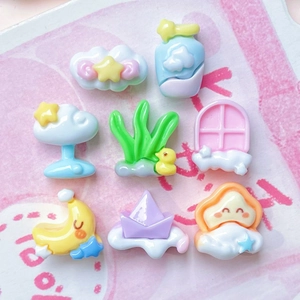 Assorted pastel macaron resin charms including clouds, stars, and ducks for DIY crafts