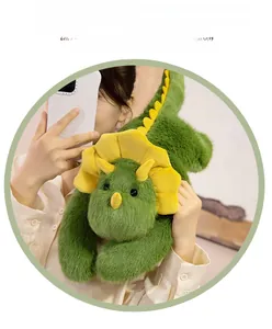 Detail of green plush triceratops doll showing soft furry texture and yellow frill detail