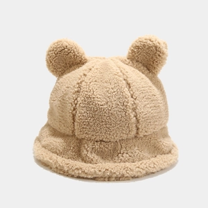 Detailed texture of khaki sherpa bucket hat with cute 3D bear ears for winter