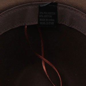 Interior detail of brown wool felt hat showing fabric sweatband and care label