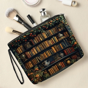 Cosmetic pouch with vintage bookshelf print featuring makeup brushes and perfume bottles