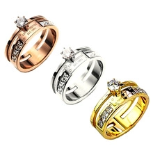 Three-piece ring set in rose gold, silver, and gold with sparkling cubic zirconia stones